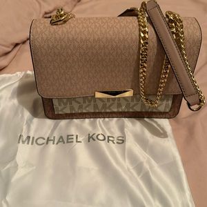 Michael Kors rose gold shoulder/crossbody bag.